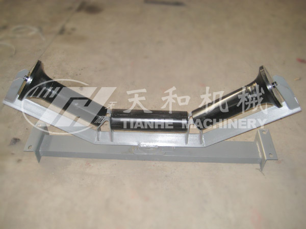 Carrier friction self-aligning idler